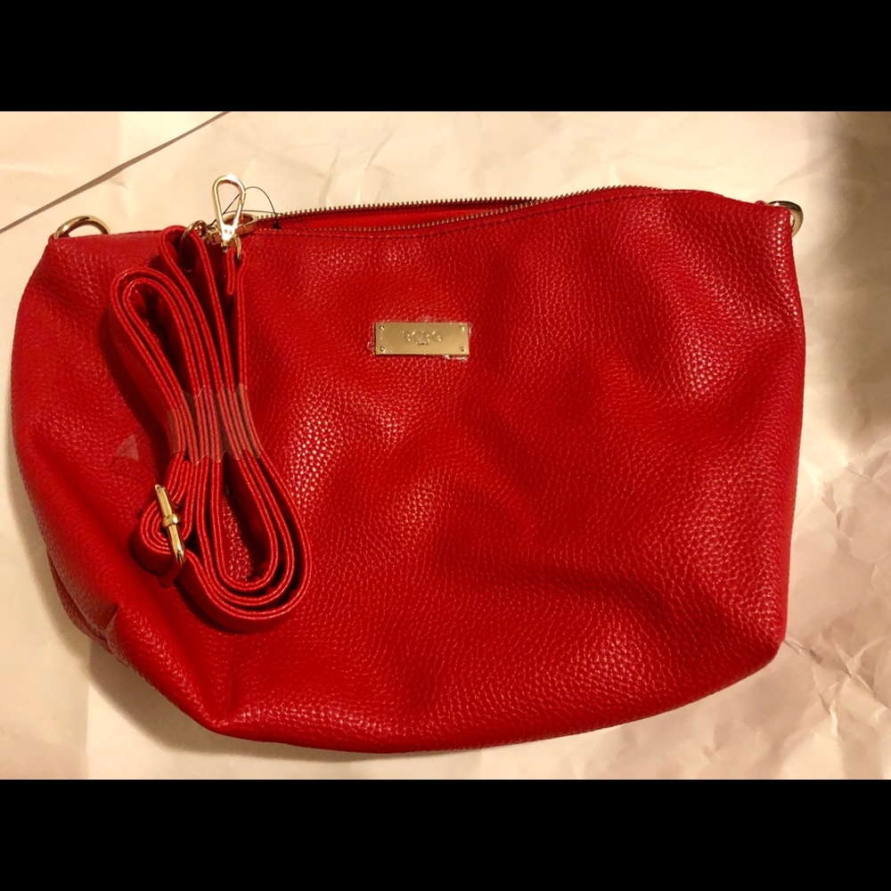 Red BCBG bag. New no tags. Handle attached inside